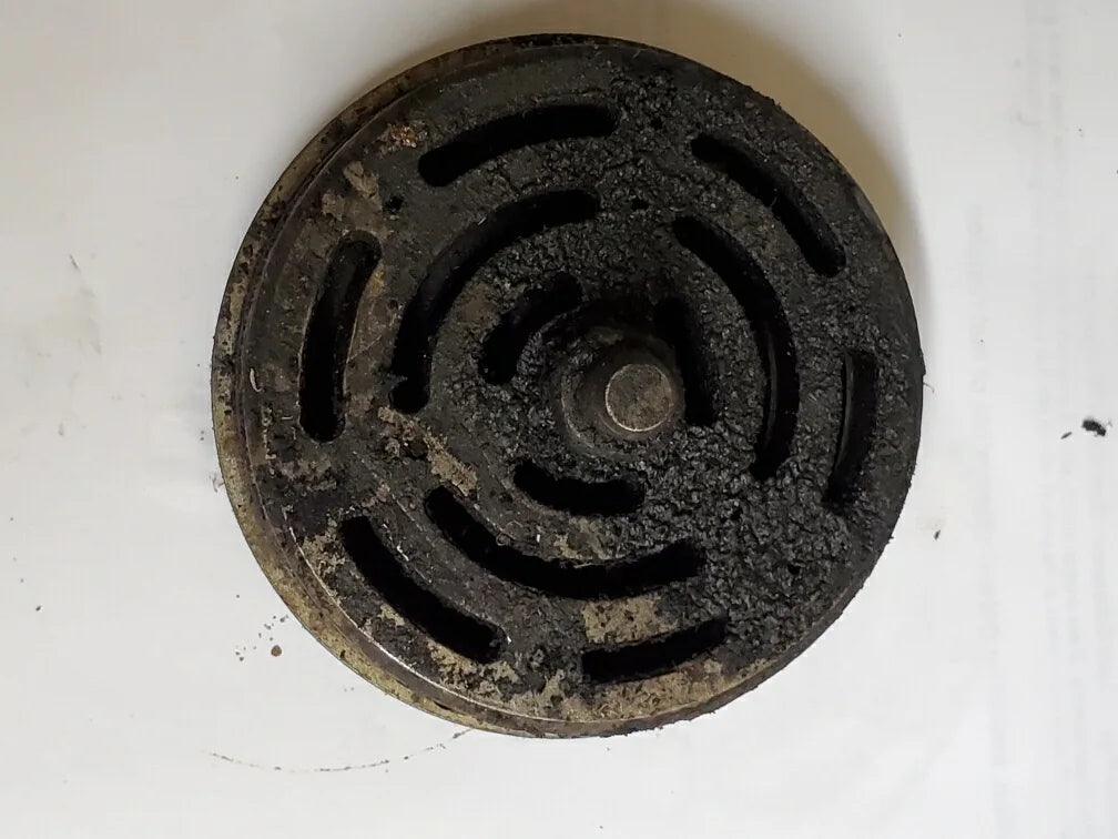 Natural-gas compressor valve with heavy deposits before VTI treatment